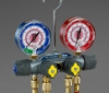 Picture of 49975 Yellow Jacket TITAN® A2L 4-Valve Manifold 3-1/8" (80mm) Gauges, PLUS II™ 1/4" Hoses 60" 3-Pak RYB, 3/8" Vacuum/ Charging Hose 60" Y, R-32/454B/410A